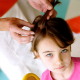 girl getting checked for head lice